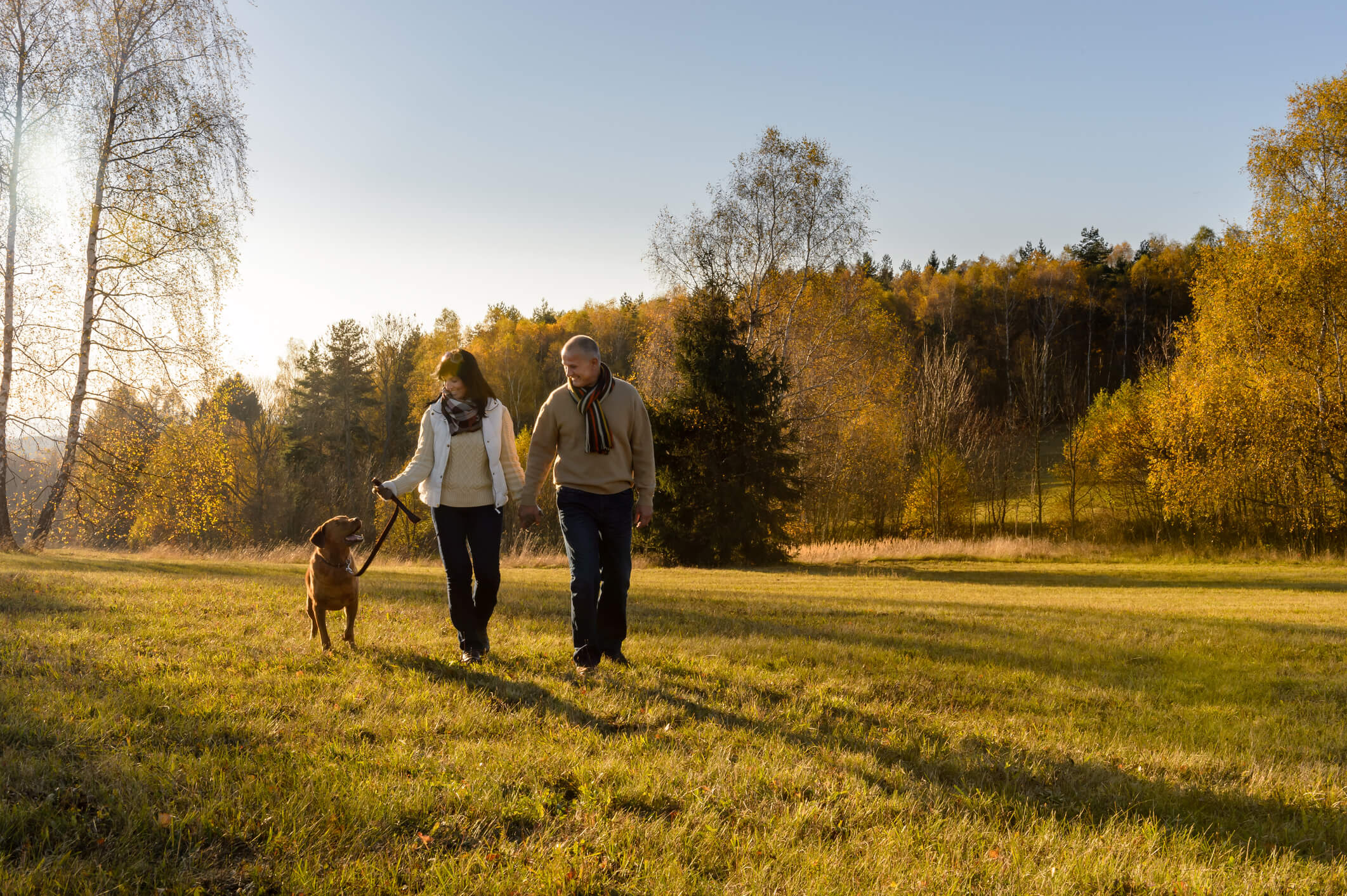 A couple staying active by walking daily as one way to prevent Alzheimer's disease.